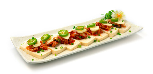 Tofu Kimchi Small Bite ontop Green Chili and Garlic decorate carved leek and spring onion