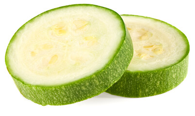 fresh green zucchini or marrow slices isolated on white background. full depth of field. clipping path