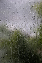 Rain on window pain on a wet and gloomy day. High quality photo