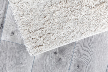 white home carpet on parquet floor