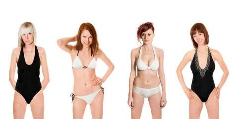 Portraits of four sexy models wearing white and black swimwear, isolated on neutral studio background