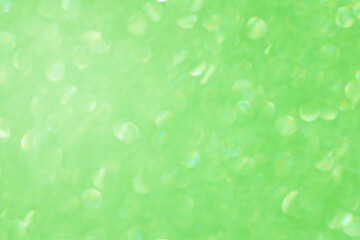 Fototapeta premium Green glitter bokeh circle glow blurred and blur abstract. Glittering shimmer bright luxury . White and silver glisten twinkle for texture wallpaper and background backdrop. 