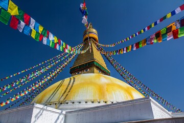 KATHMANDU, NEPAL - OCTOBER 30, 2017. Landmark of Nepal - Boudhanath stupa with many flags hanging...