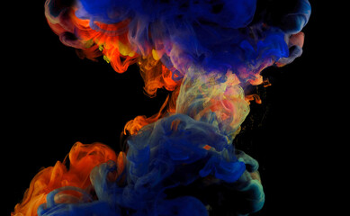 Fototapeta premium Color drops in water , abstract color mix , drop of Ink color mix paint falling on background,