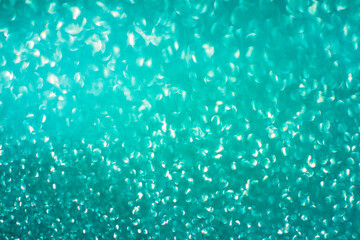 Blue glitter bokeh circle glow blurred and blur abstract. Glittering shimmer bright luxury . White and silver glisten twinkle for texture wallpaper and background backdrop.
