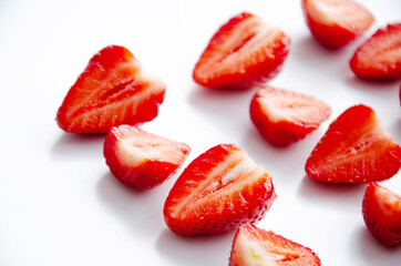 red raw fresh strawberries on white background, close view 