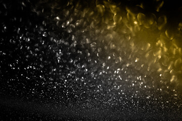 Black glitter bokeh circle glow blurred and blur abstract. Glittering shimmer bright luxury . White and silver glisten twinkle for texture wallpaper and background backdrop.
