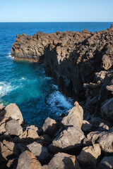 Volcanic coastline landscape. Rocks and lava formations in El Hierro, Canary islands, Spain. High quality photo