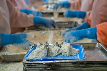 Processing crispy breaded shrimp in a food factory in Vietnam