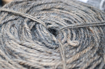 Stranded threads. A tangle of yarn. Entangled confusing thread on a roll.