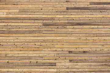 Background with many natural rustic pinewood plank timber on exterior outdoor  wall.