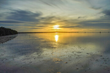 Beautiful sunset on the beach and the sea.