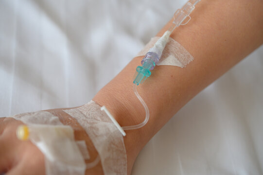 Patient's hand with Total Parenteral Nutrition (TPN) being administered into vein