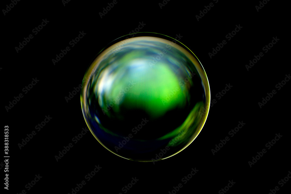 Wall mural an abstract sphere with a blurry pattern isolated on black background. abstract circle in blur.