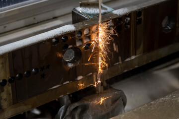 The operation of  wire-EDM machine cutting the die insert parts. The hi-technology of mild and die...