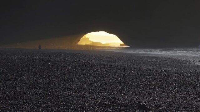 Light of Sunset in Legzira Beach with huge rock arch. Famous Tourism area in Morocco, Travel adventure in beautiful nature Landscape
