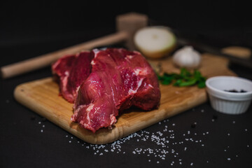 Raw meat with wooden table