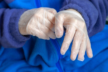 Hands in disposable medical protective gloves close-up. Healthcare concept, quarantine, personal protection