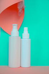 white cosmetic tubes on a decorated background
