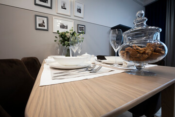 table with cutlery lying on them