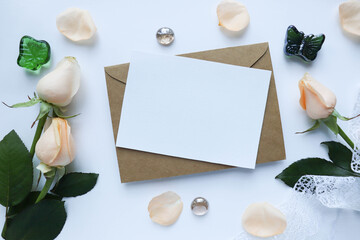 Fototapeta na wymiar postcard mockup. small bouquet of beige roses on a white background. congratulation. invitation