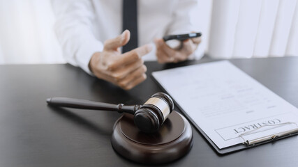 lawyer consulting with client discussing about contract.