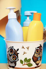 shampoo and liquid soap in a baby bathing bucket