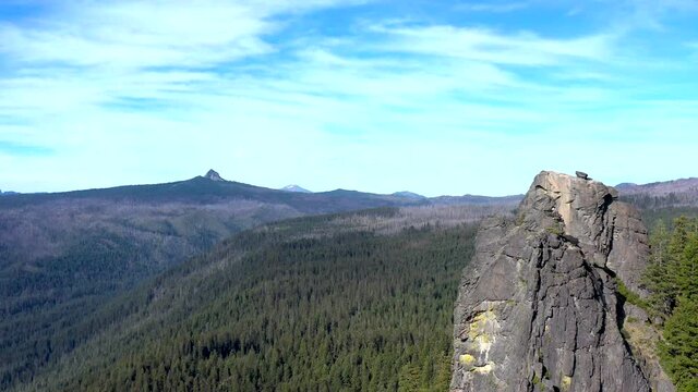 Bessie Rock in the southern Oregon Cascades, A volcanic feature, viewed with an aerial perspective showing the beautiful landscape and peaks in the background