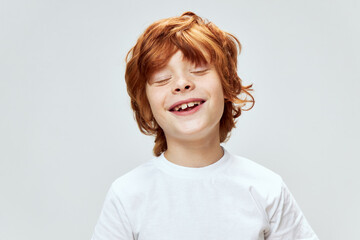 funny redhead boy smile closed eyes white t-shirt