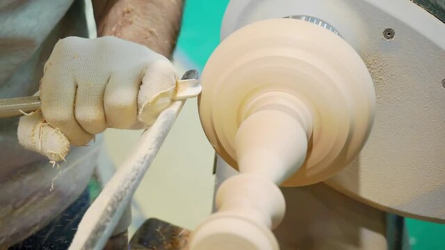 wood processing. production of a wooden detail on a lathe. close-up