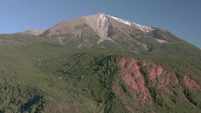 Aerial view moves away from Mount Sopris in Carbondale Colorado