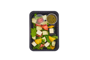 proper healthy diet
top view isolated white background, vegetable salad paprika peppers, tomatoes, cucumbers, fetax cheese, lettuce and olive oil