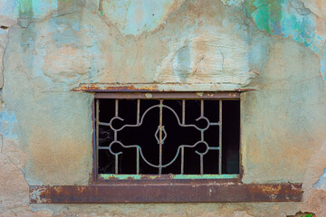 old basement window with vintage street house wall plaster