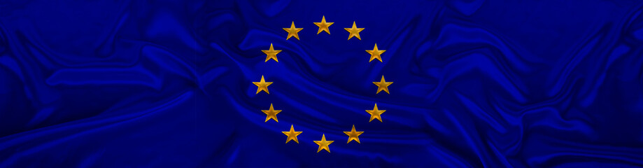 long panorama of the national European Union flag on delicate silk with folds, the concept of historical, tourism, emigration, economics, politics, global world trade