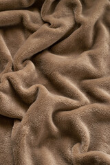 A warm blanket plush micro fleece fabric, swirled into a pattern background © 682A_IA