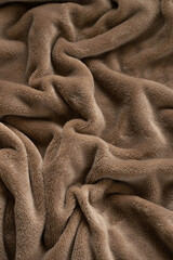A warm blanket plush micro fleece fabric, swirled into a pattern background © 682A_IA