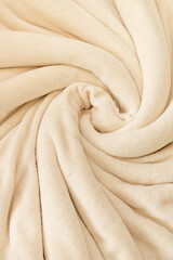 A warm blanket plush micro fleece fabric, swirled into a pattern background © 682A_IA