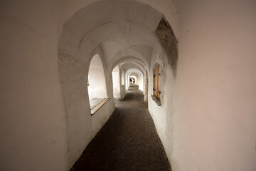 The typical low arcades of the town of Glorenza, province of Bolzano, South Tyrol, Italy