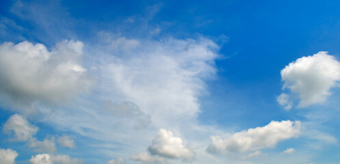 Blue sky and beautiful clouds on horizon. Wide photo.