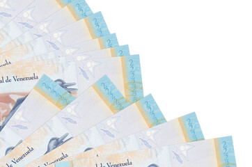 2 Venezuelian bolivar bills lies isolated on white background with copy space stacked in fan close up