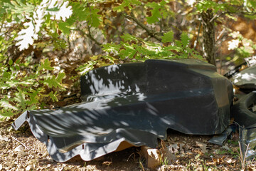 Pile of garbage on green grass in nature environmental problems. Nature disaster concept