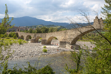 BOBBIO, ITALY, AUGUST 20, 2020 - The "Old" Bridge" or "Gobbo Bridge" also "Devil Bridge" in Bobbio, Piacenza province, Trebbia Valley, Emilia Romagna, Italy.