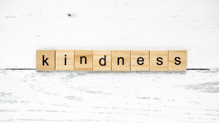 worlh kindness day. words from wooden cubes with letters. good heart photo