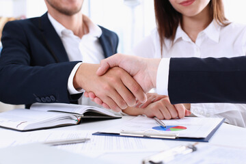 Greup business people shake hands as hello in office closeup. Friend welcome, introduction, greet or thanks gesture, product advertisement, partnership approval, arm, strike a bargain on deal concept