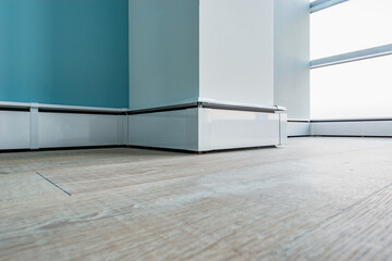 Fototapeta premium White plinth along the wall and floor.