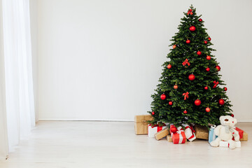 Fototapeta na wymiar Christmas tree with gift decor for the New Year 2022 holiday winter place for inscription