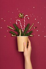 Christmas holiday greeting card template on pink paper background.