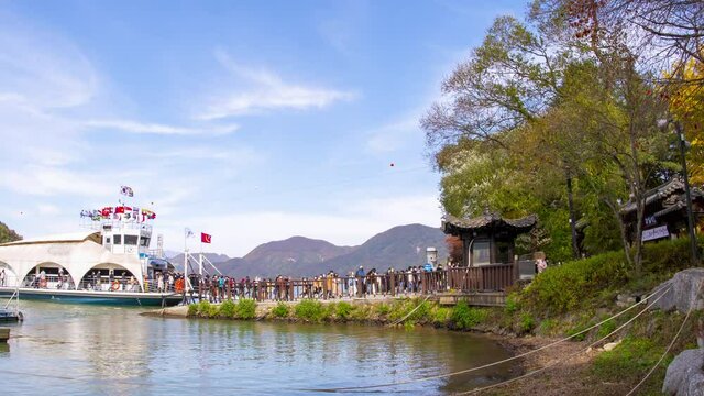 Seoul,South Korea - October 2020 : In autumn, tourists visit the autumn leaves. Follow in the footsteps of famous series By taking a boat across the shore to Nami Island.