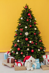 Christmas tree pine with gift decor for new year yellow