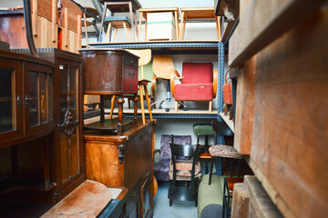 Vintage furniture shop. Second hand furniture market. Retro furniture for sale. Antique vintage store. 
